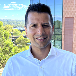 Sandeep, Head of Applications at Hearing Australia, smiling warmly